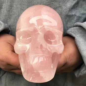 Естественият розов кварцов кристален череп е ръчно издълбан и полиран за подаръци за декорация на енергийна медитация